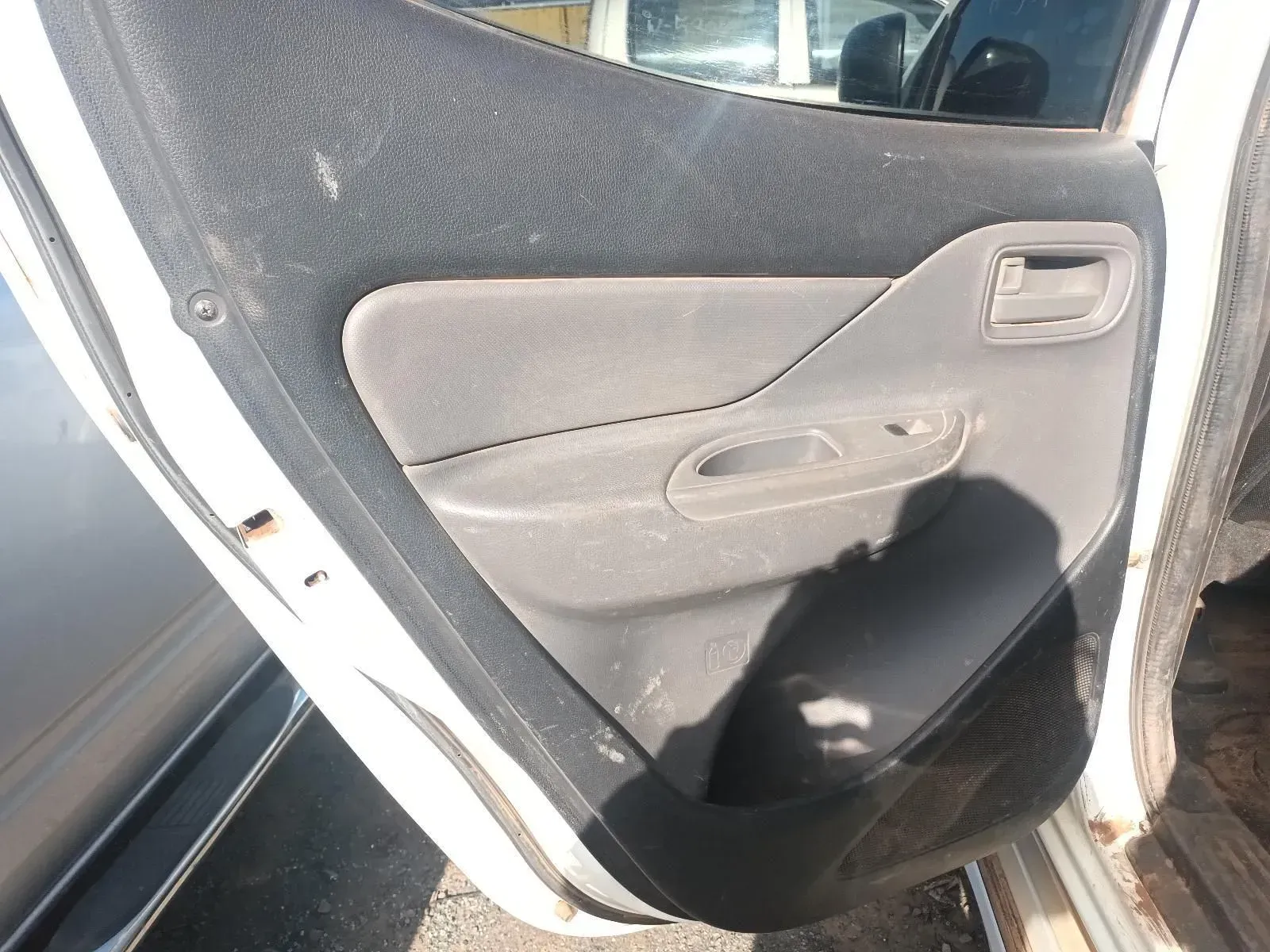 Car Door Interior With a Gray Textured Panel and a Handle — South West 4WD Wreckers In Brisbane, QLD