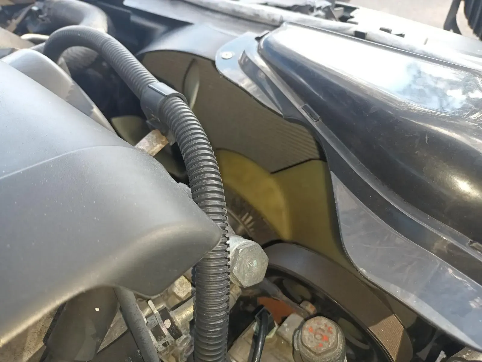 Close-up of a Car Engine Bay, Showing Black Plastic Components, a Corrugated Tube — South West 4WD Wreckers In Brisbane, QLD