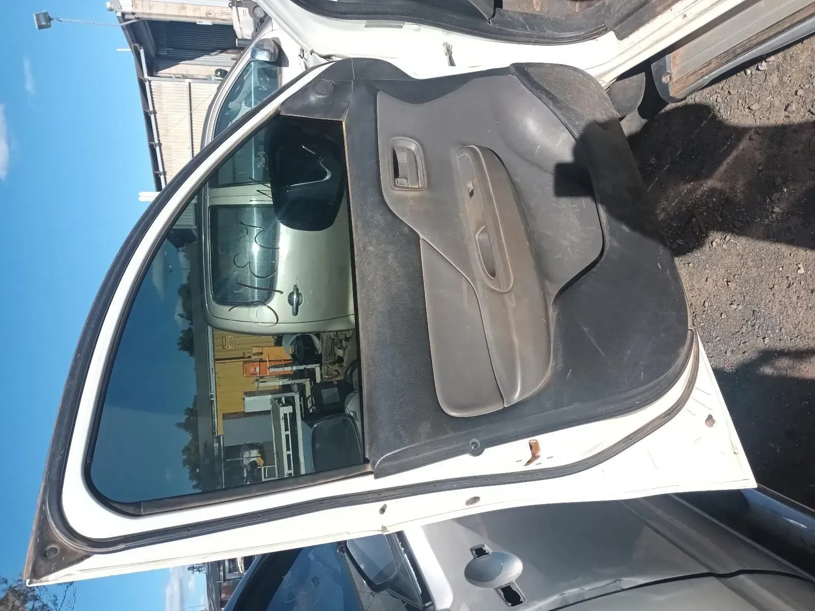 White Car Door Open, Showing the Interior and a Vehicle Behind It — South West 4WD Wreckers In Brisbane, QLD