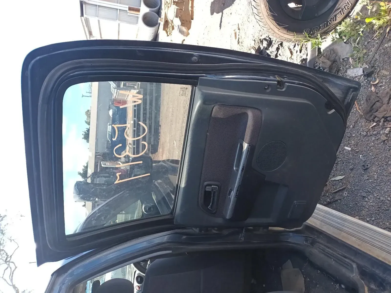 Black Car Door, Opened in a Salvage Yard — South West 4WD Wreckers In Brisbane, QLD
