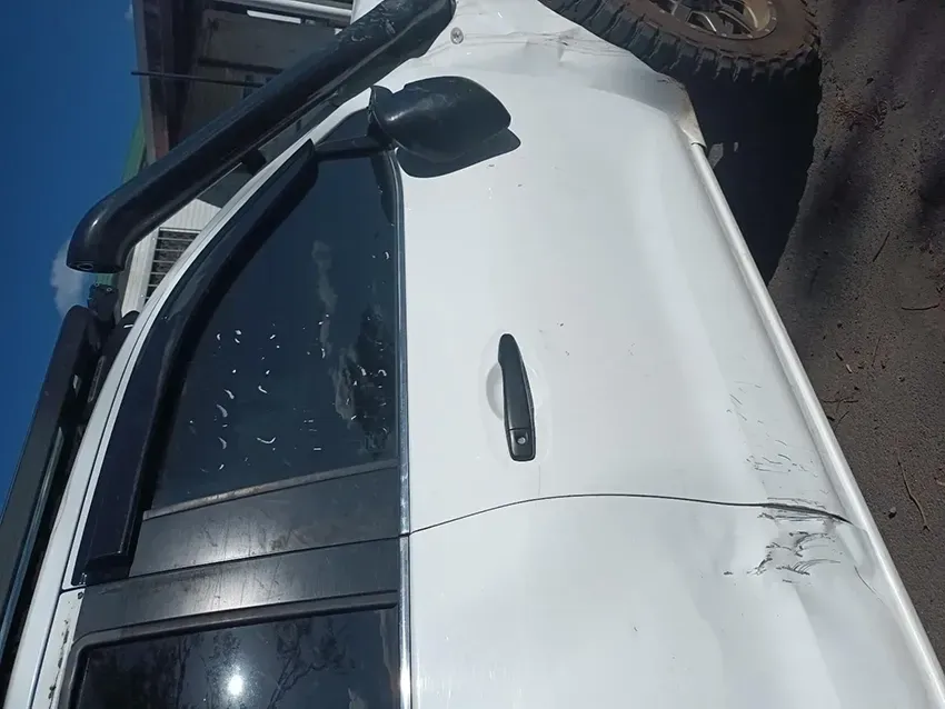 A White Truck is Parked on the Side of the Road — South West 4WD Wreckers In Brisbane, QLD