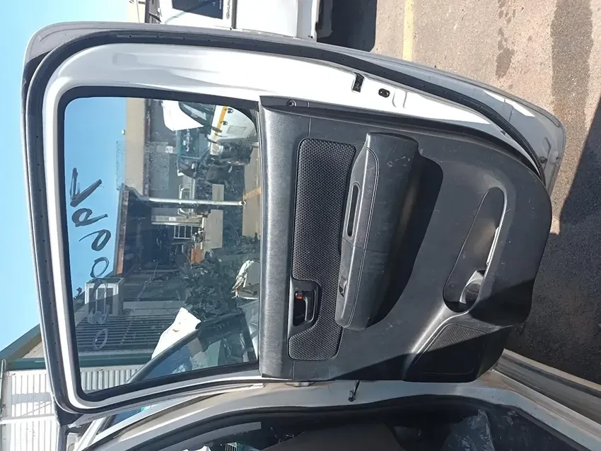 A Car is Parked in a Parking Lot With the Door Open  — South West 4WD Wreckers In Brisbane, QLD