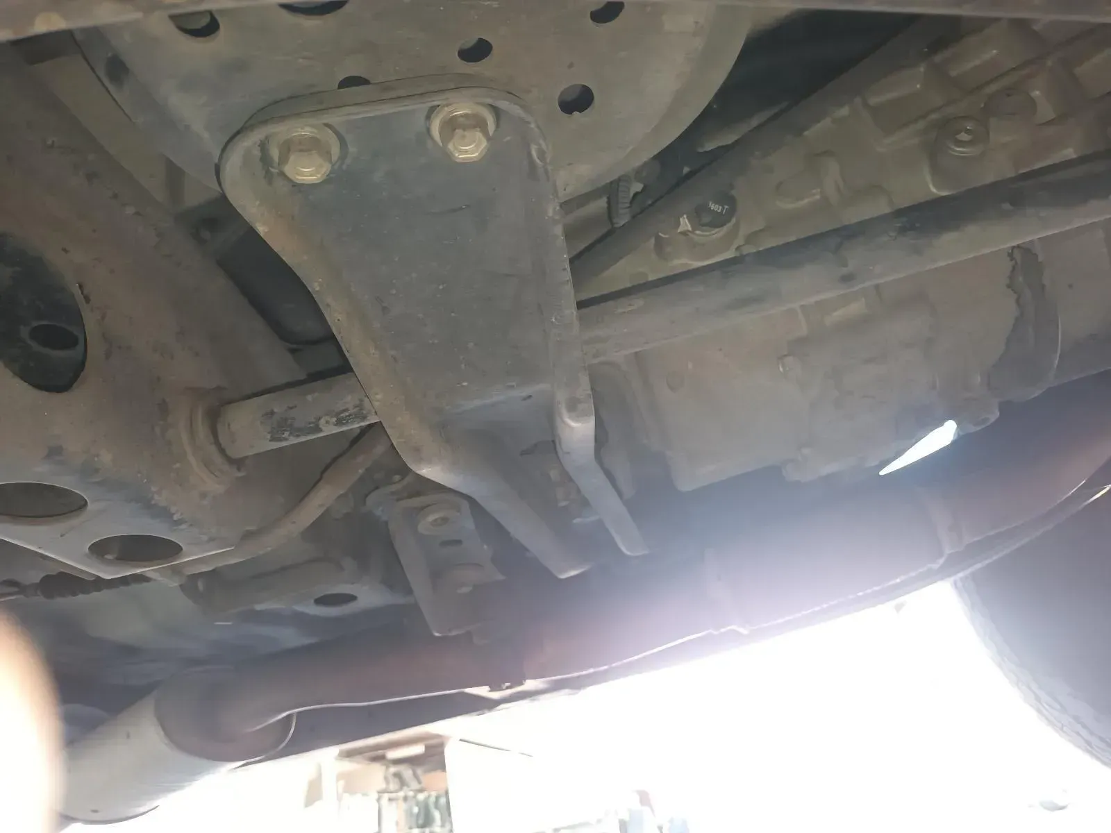 Underside of a Vehicle Showing a Black Metal Bracket Bolted to the Chassis — South West 4WD Wreckers In Brisbane, QLD