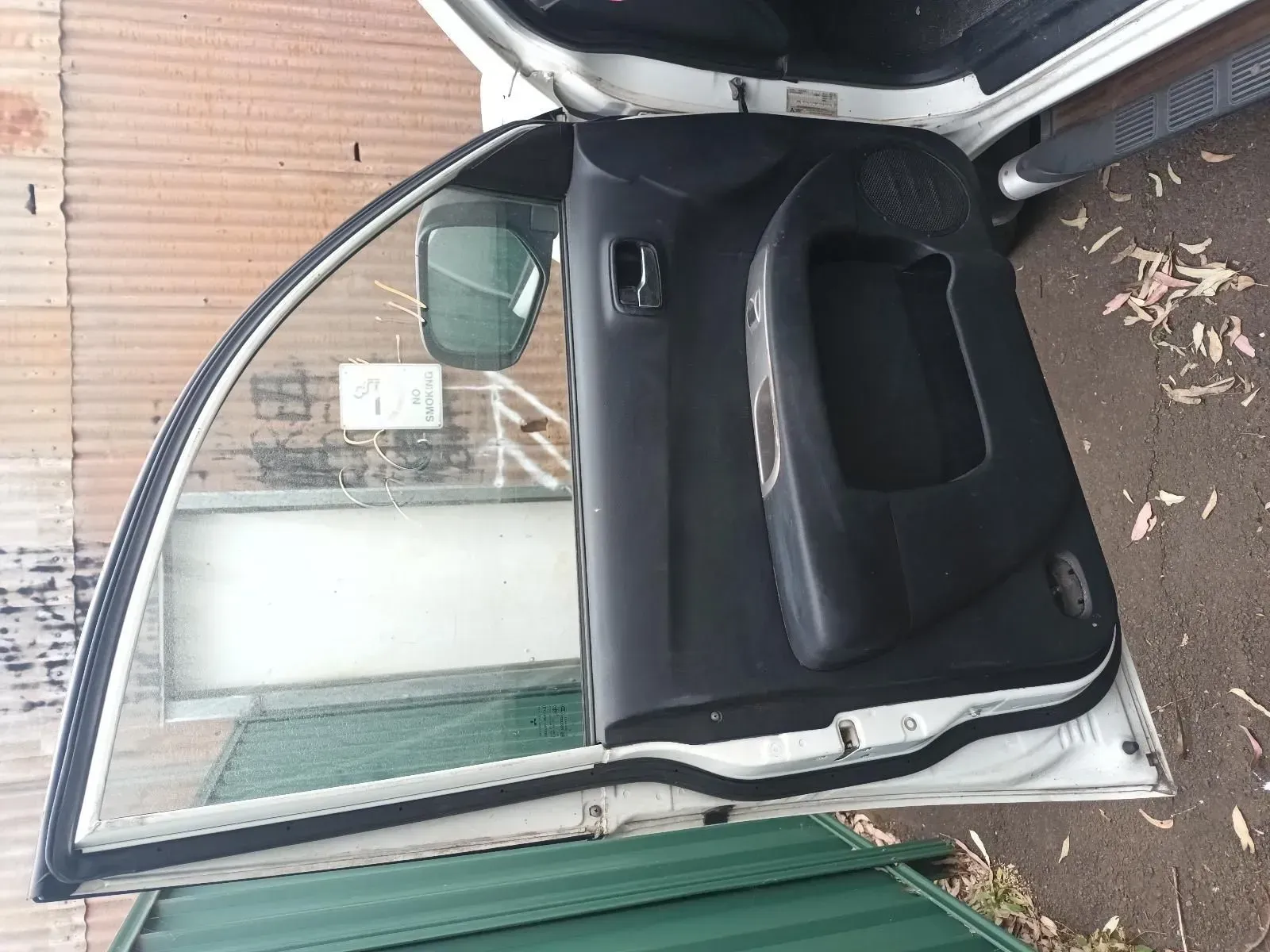 Open Car Door With Black Interior, a Side View Mirror, and a Window — South West 4WD Wreckers In Brisbane, QLD
