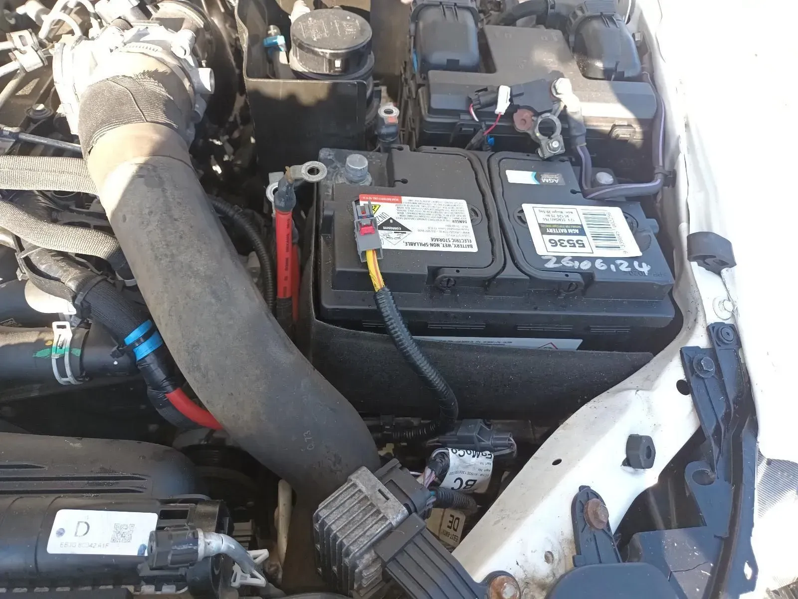Car Engine Bay With Black Battery and Connected Wires — South West 4WD Wreckers In Brisbane, QLD