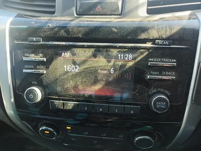 A Close Up of a Car Radio with a Dirty Dashboard — South West 4WD Wreckers In Brisbane, QLD