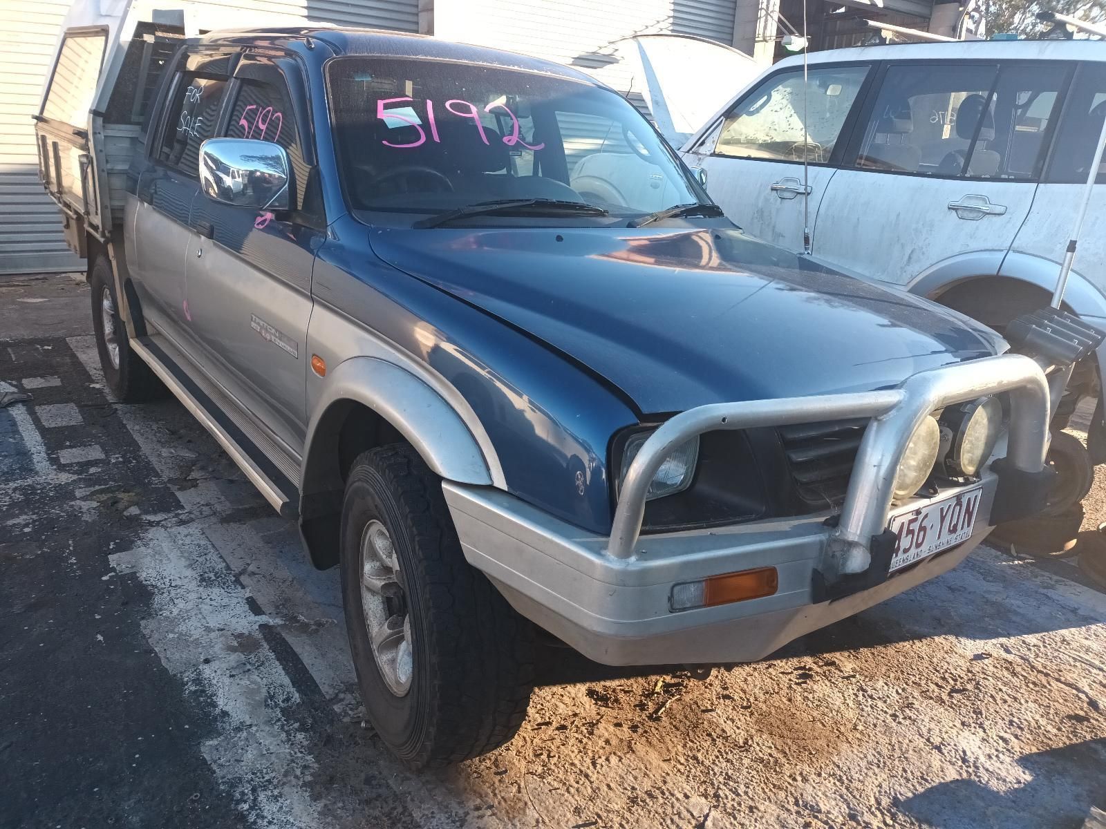 A Blue Truck with the Numbers on the Windshield — South West 4WD Wreckers in Harristown, QLD
