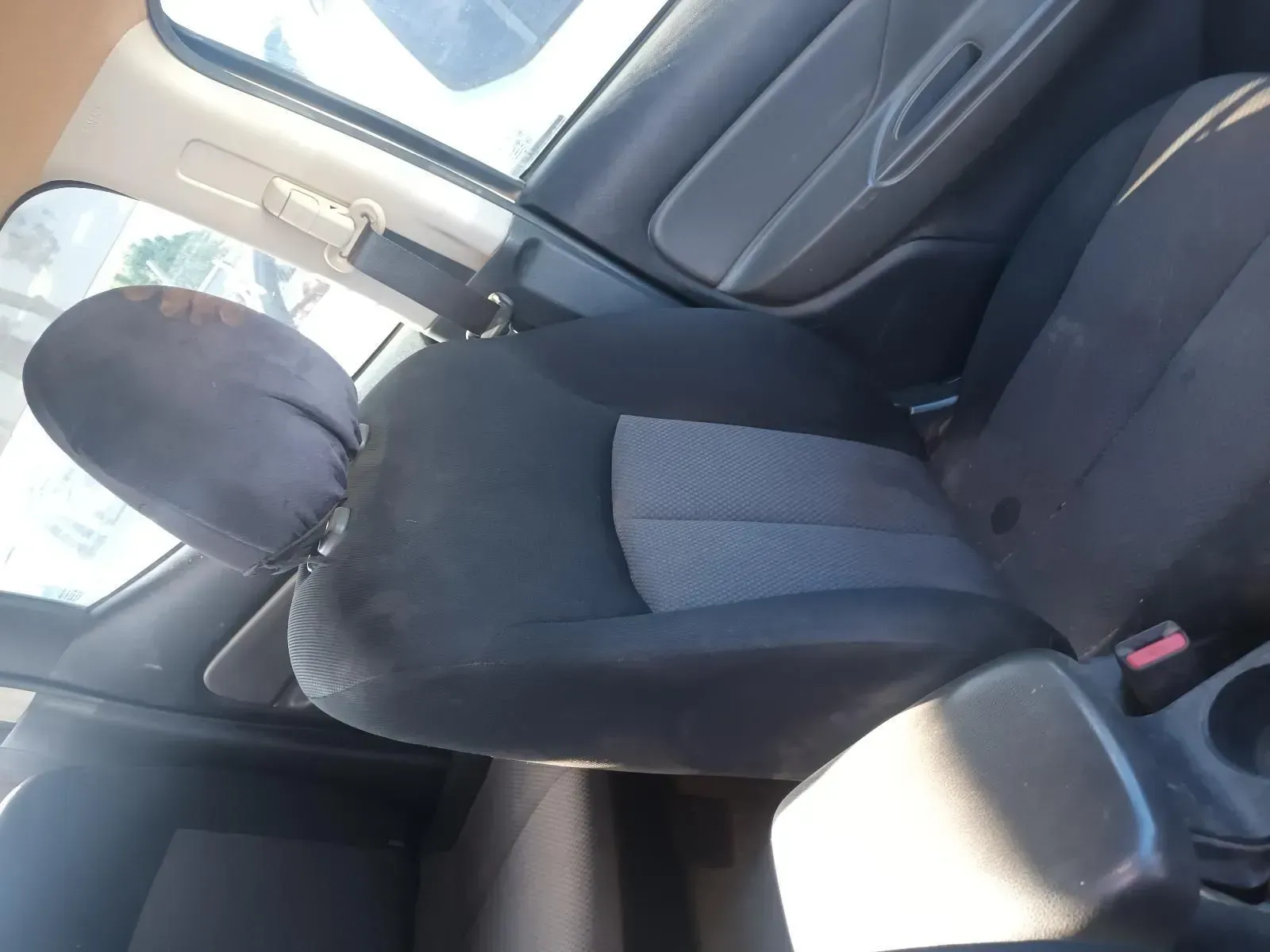 Inside a Car: Driver's Seat With Black Cover on Headrest — South West 4WD Wreckers In Brisbane, QLD