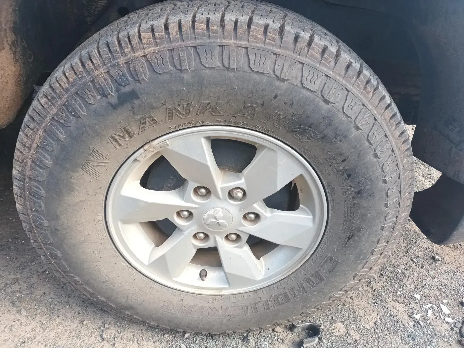 Silver Car Wheel With a Tyre That Reads — South West 4WD Wreckers In Brisbane, QLD