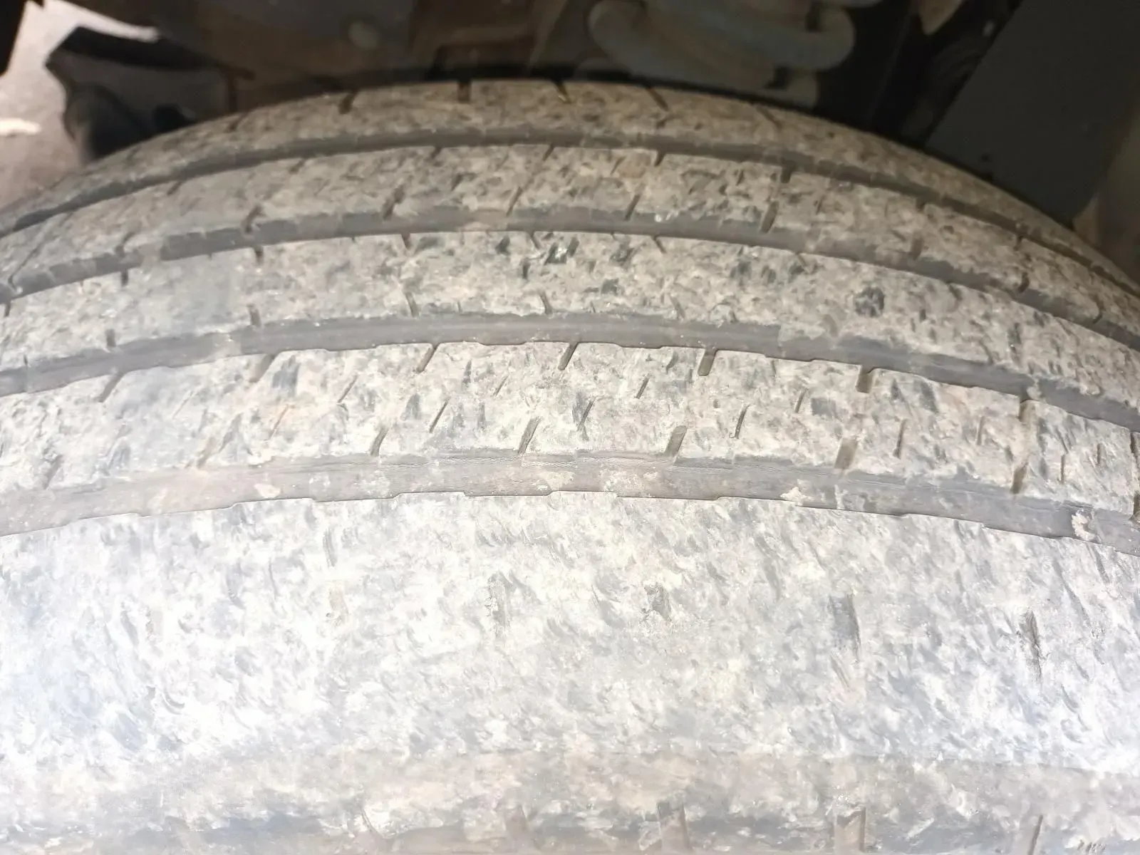 Close-up of a Used Tyre With Visible Tread Wear, Covered in Dirt — South West 4WD Wreckers In Brisbane, QLD