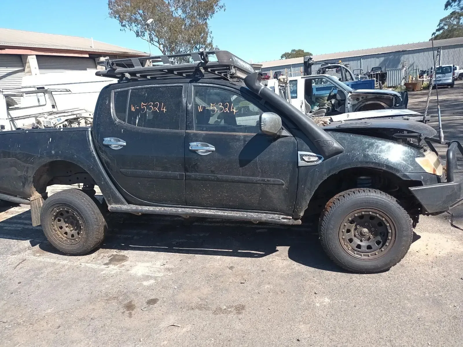 Black Mitsubishi Triton Pickup Truck With Off-road Modifications — South West 4WD Wreckers In Brisbane, QLD