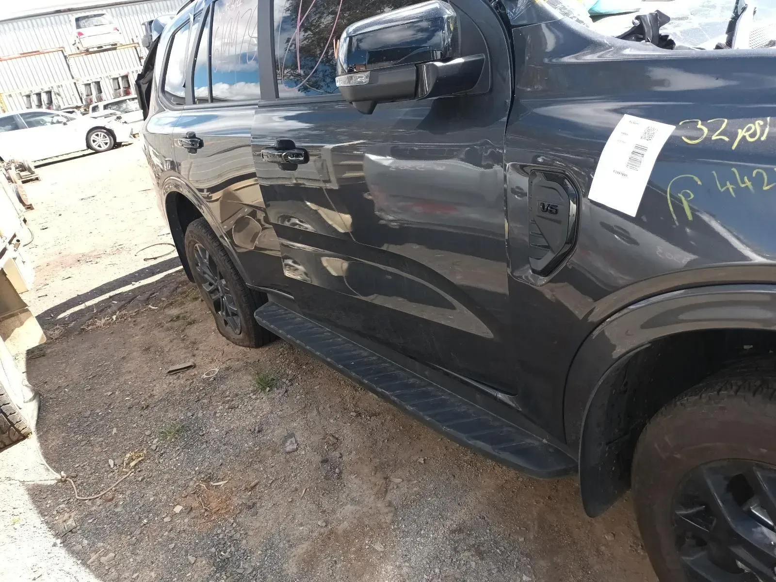 Dark Gray SUV With Black Running Boards Parked Outdoors, in a Salvage Yard — South West 4WD Wreckers In Brisbane, QLD