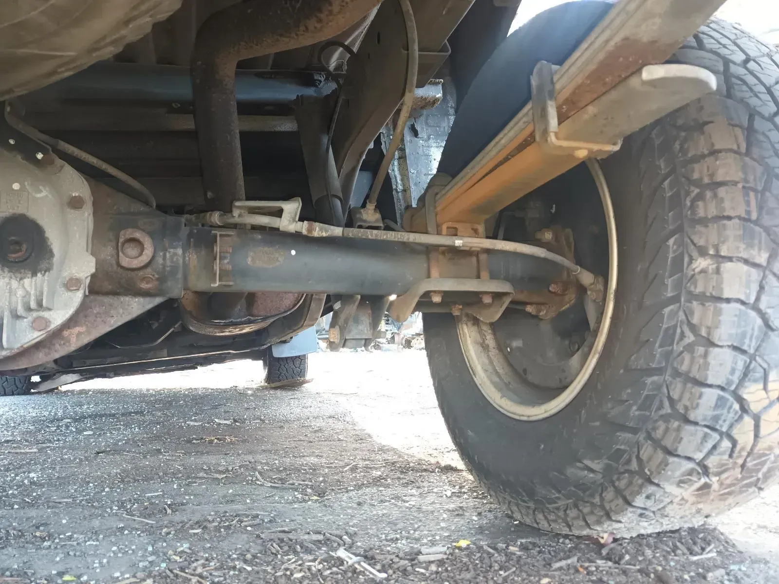 Underside of a Vehicle Showing Rear Axle, Wheel, Suspension, and Exhaust System — South West 4WD Wreckers In Brisbane, QLD