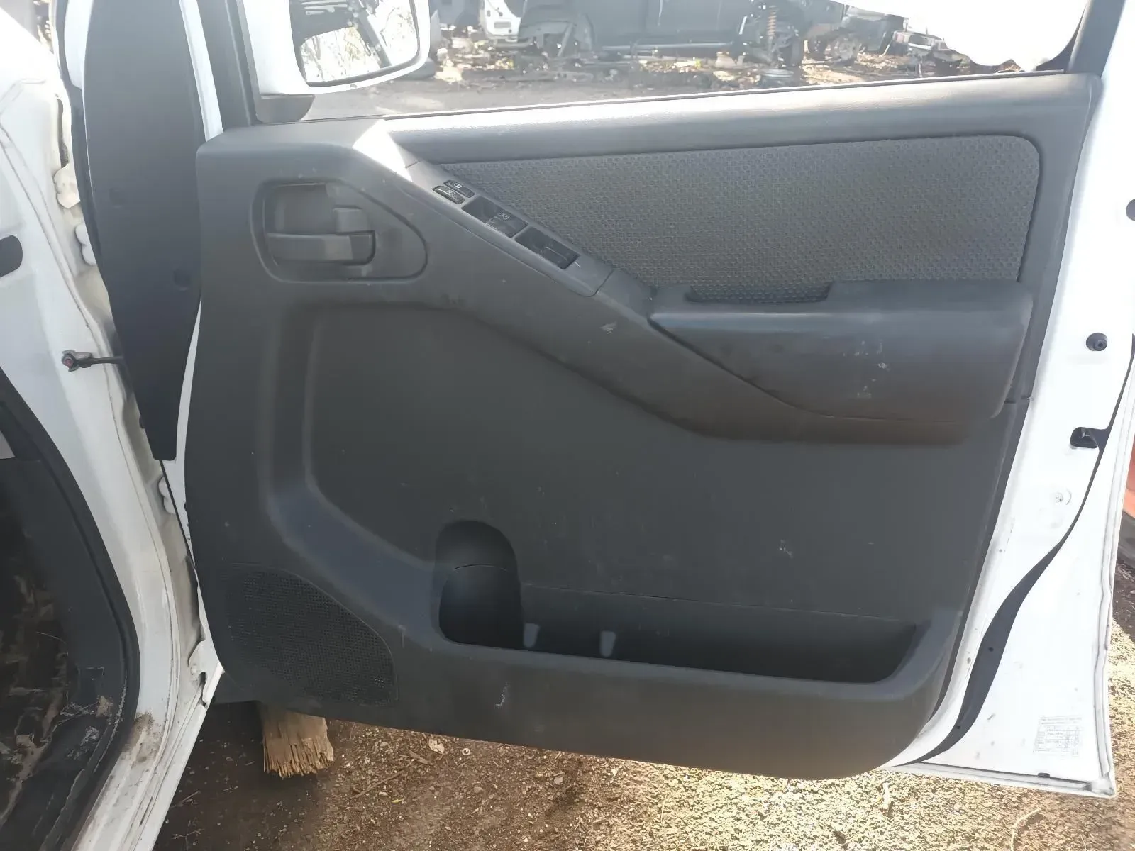 Black Interior Door Panel in a White Truck, With a Cup Holder and Speaker Grille — South West 4WD Wreckers In Brisbane, QLD