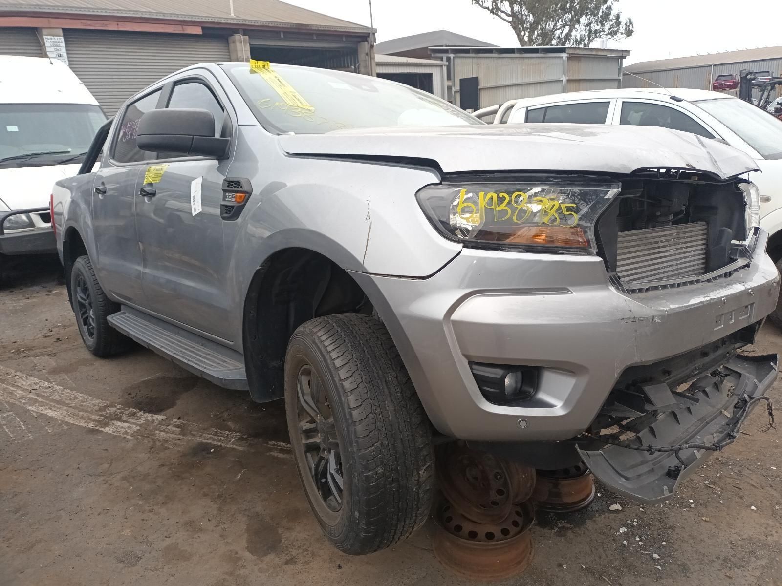 A Ford Ranger is Sitting on the Ground in a Parking Lot — South West 4WD Wreckers In Harristown, QLD