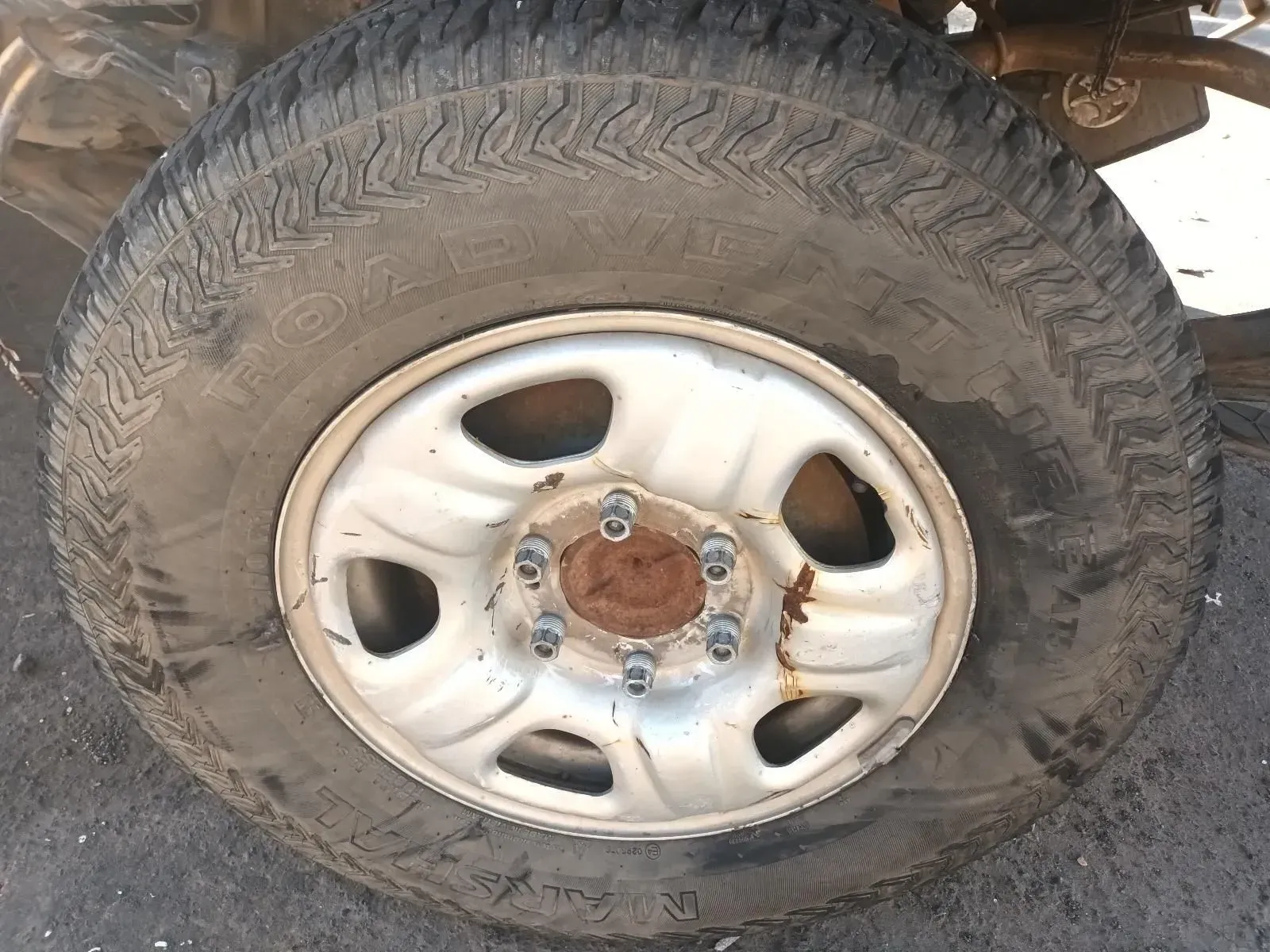 A Weathered Tyre on a Rusty Steel Wheel; Outdoors — South West 4WD Wreckers In Brisbane, QLD