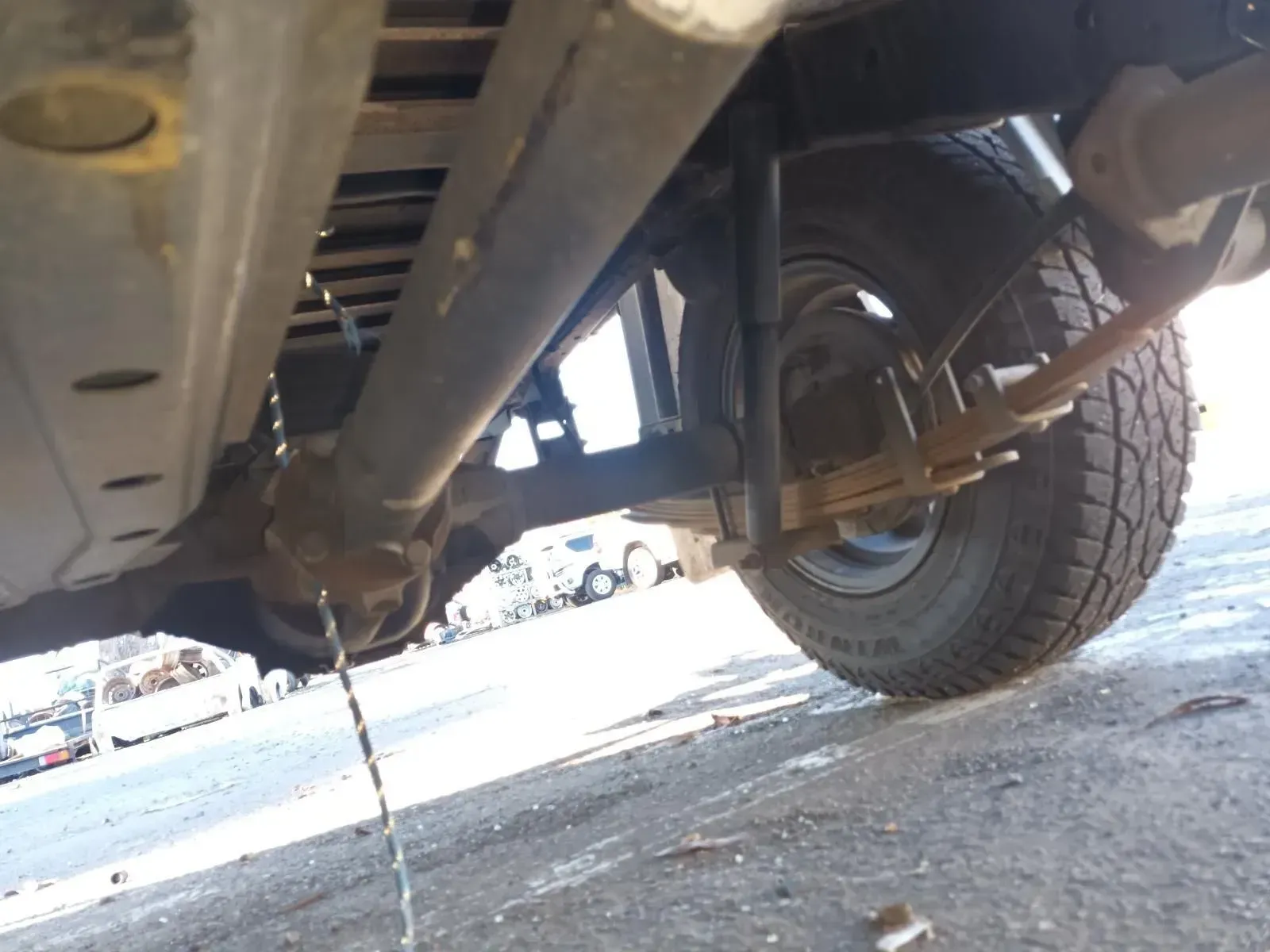 Undercarriage of a Vehicle With a Drive Shaft and Rear Wheel Visible — South West 4WD Wreckers In Brisbane, QLD