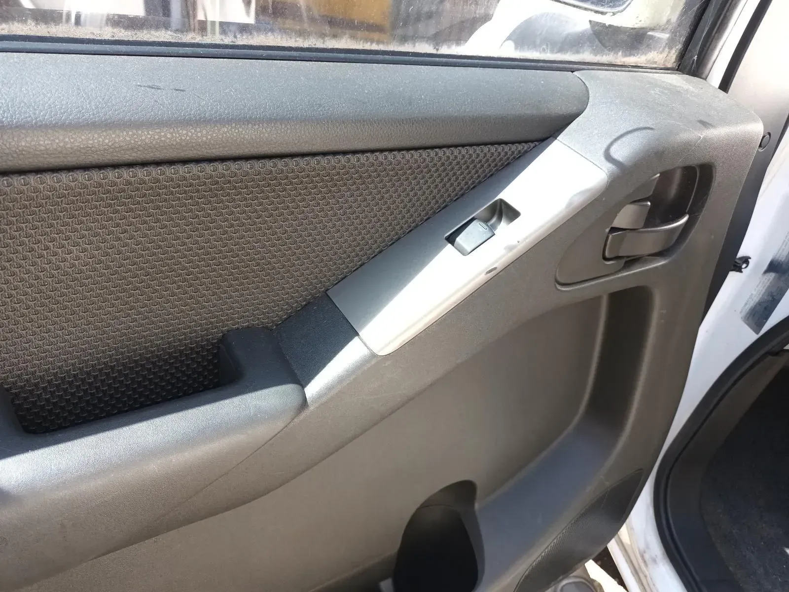 Grey Car Door Interior With Window Switch, Handle, and Fabric Panel — South West 4WD Wreckers In Brisbane, QLD