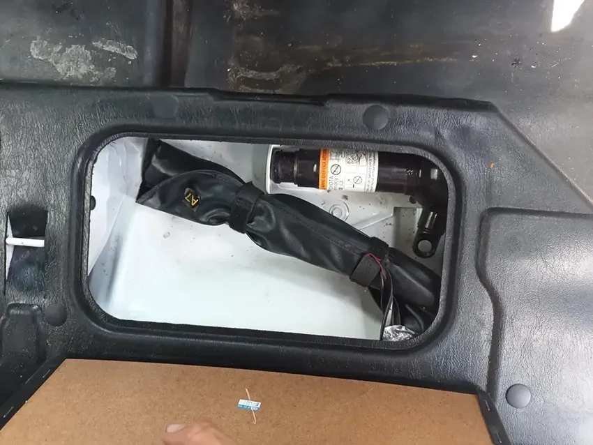 A Person is Holding a Toolbox in the Back of a Car — South West 4WD Wreckers In Brisbane, QLD