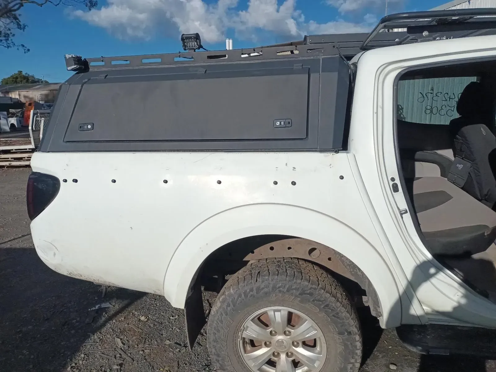 White Pickup Truck With a Black Canopy and a Roof Rack — South West 4WD Wreckers In Brisbane, QLD