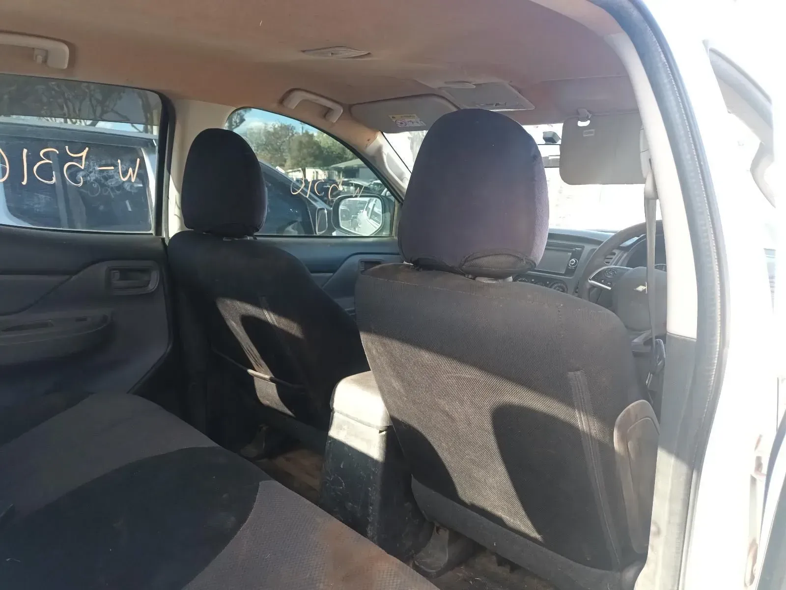 Interior of a Truck With Black Seats, Looking Toward the Front Dashboard — South West 4WD Wreckers In Brisbane, QLD