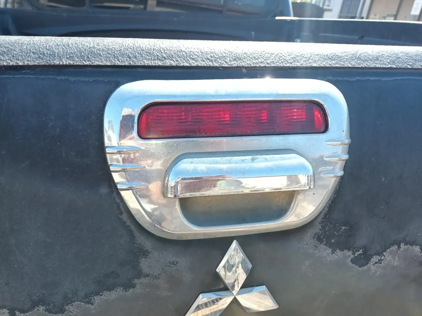 Chrome Tailgate Handle With Red Light Above — South West 4WD Wreckers In Brisbane, QLD