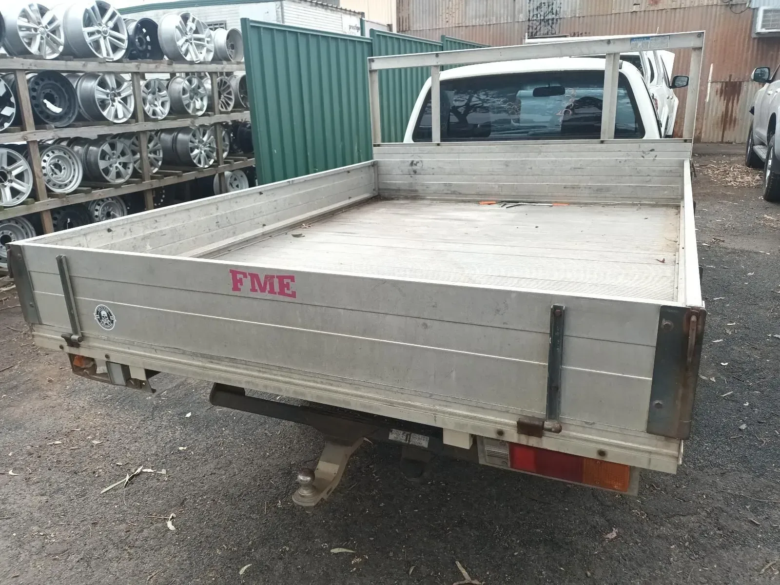 A White Pickup Truck With a Flatbed in a Junkyard — South West 4WD Wreckers In Brisbane, QLD