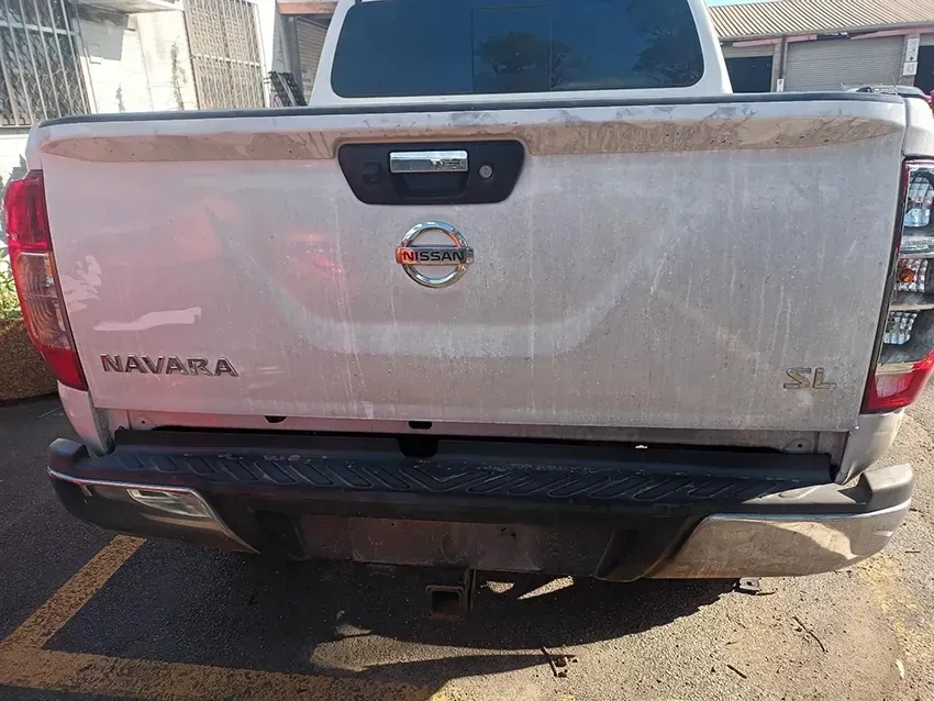 A White Nissan Navara Pickup Truck is Parked in a Parking Lot — South West 4WD Wreckers In Brisbane, QLD