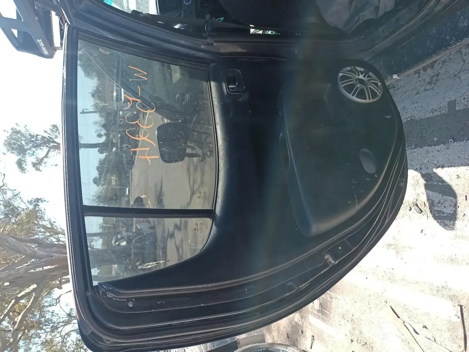 Black Car Door With Window, in an Outdoor Setting — South West 4WD Wreckers In Brisbane, QLD