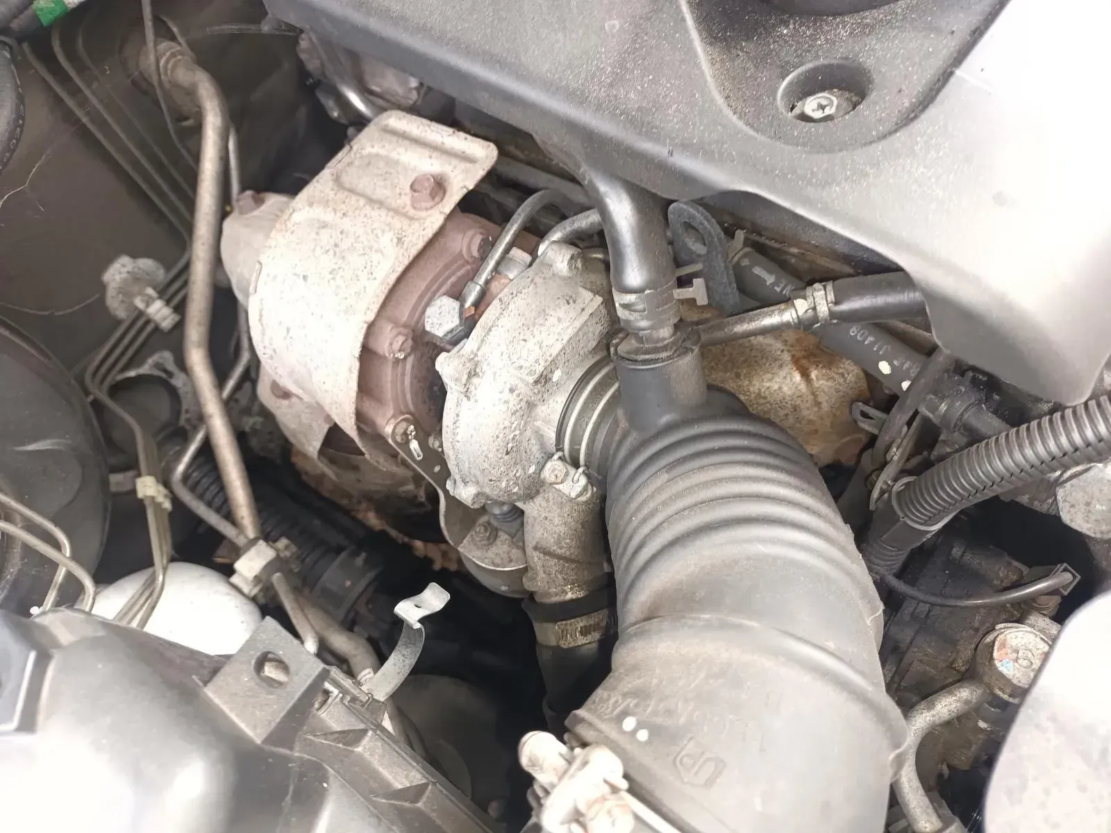 Dusty Car Engine With a Turbocharger and Intake Hose — South West 4WD Wreckers In Brisbane, QLD
