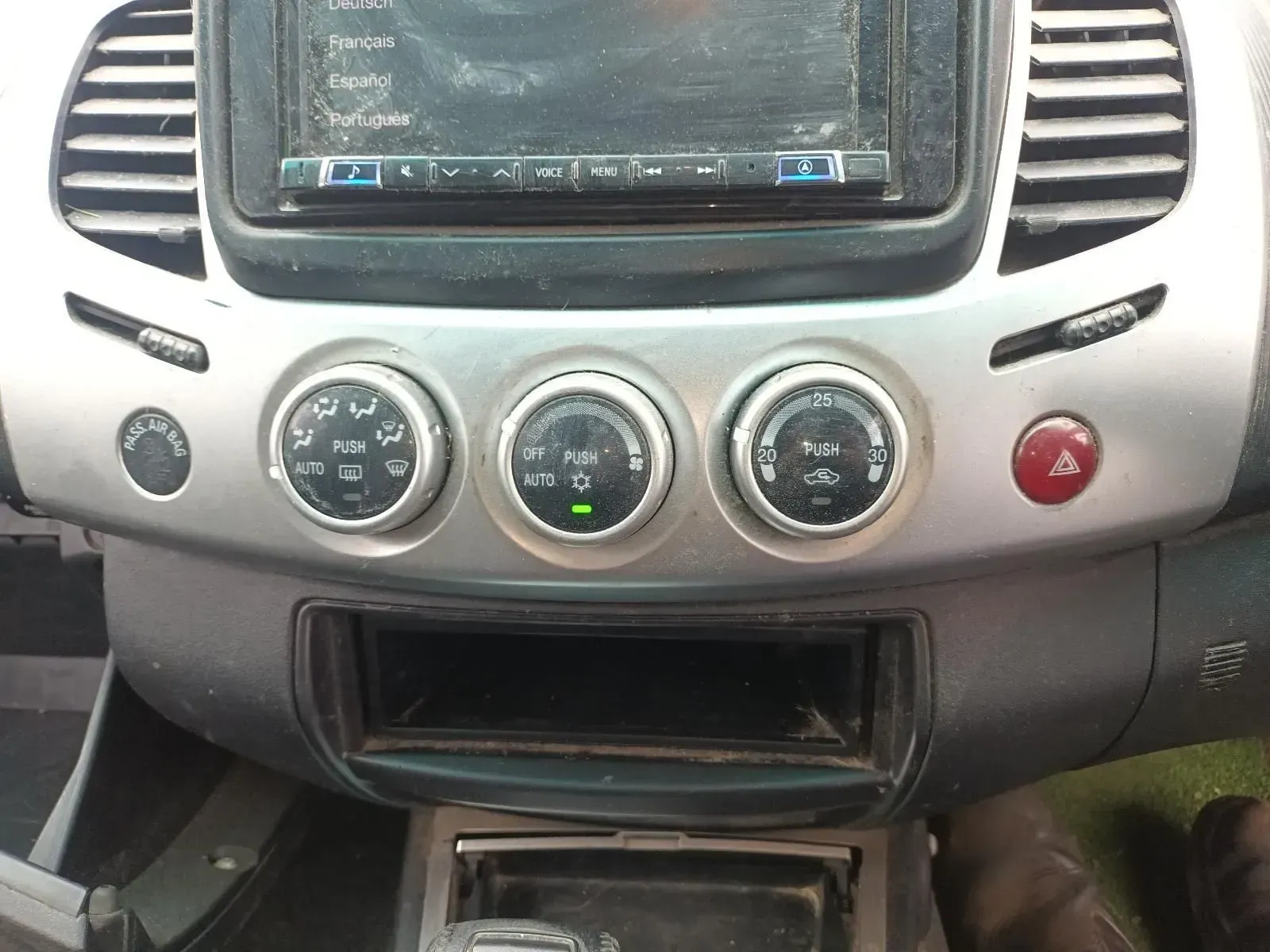 Car Dashboard With Climate Control Knobs and Aftermarket Head Unit — South West 4WD Wreckers In Brisbane, QLD