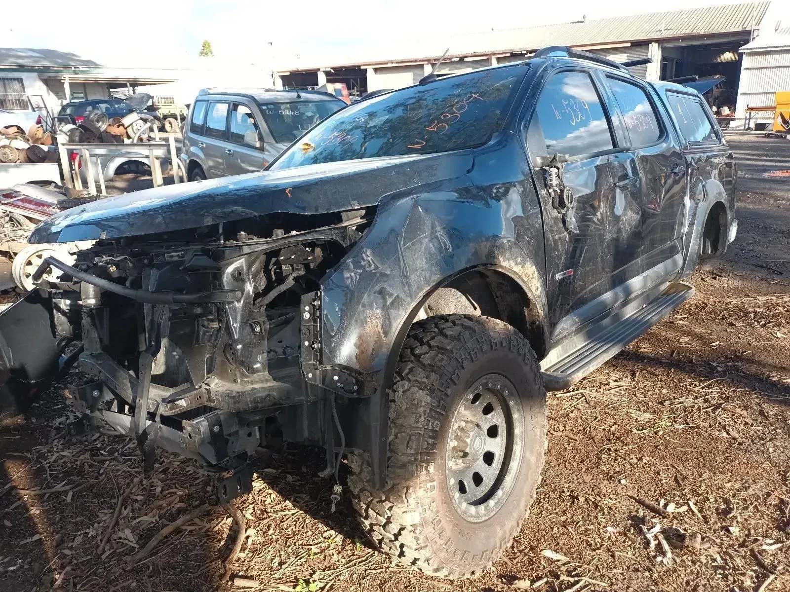 Damaged Black Truck in a Salvage Yard — South West 4WD Wreckers In Brisbane, QLD