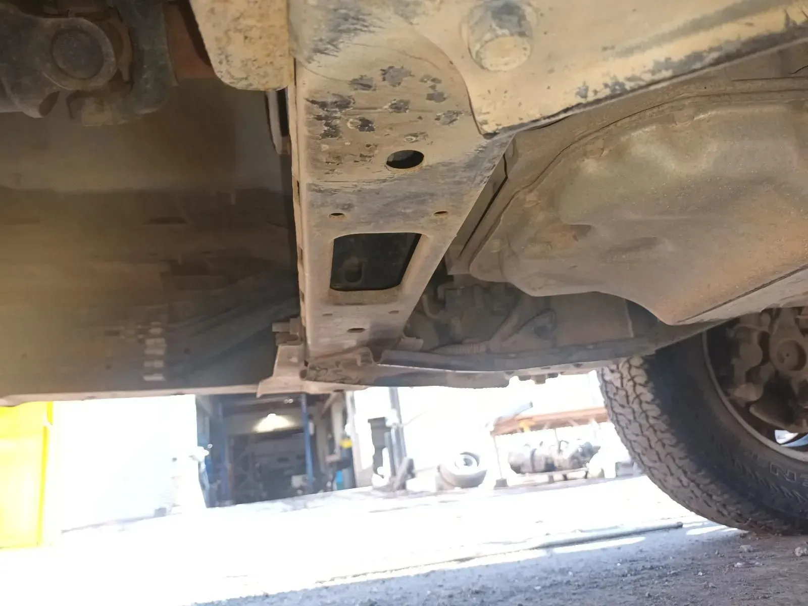 Undercarriage of a Vehicle, Showing Rust on the Frame, Fuel Tank, and Tyre — South West 4WD Wreckers In Brisbane, QLD