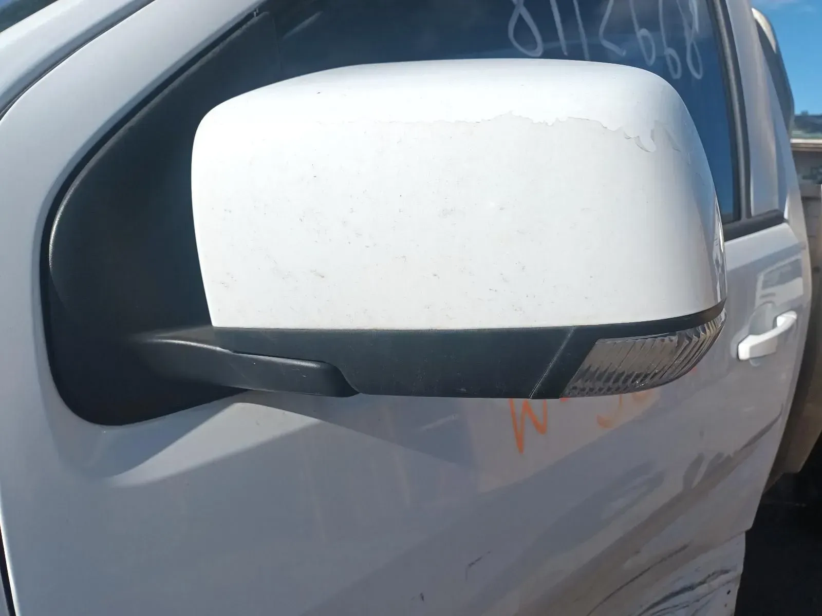 White Car Side Mirror, Black Trim, Showing Weather Damage — South West 4WD Wreckers In Brisbane, QLD
