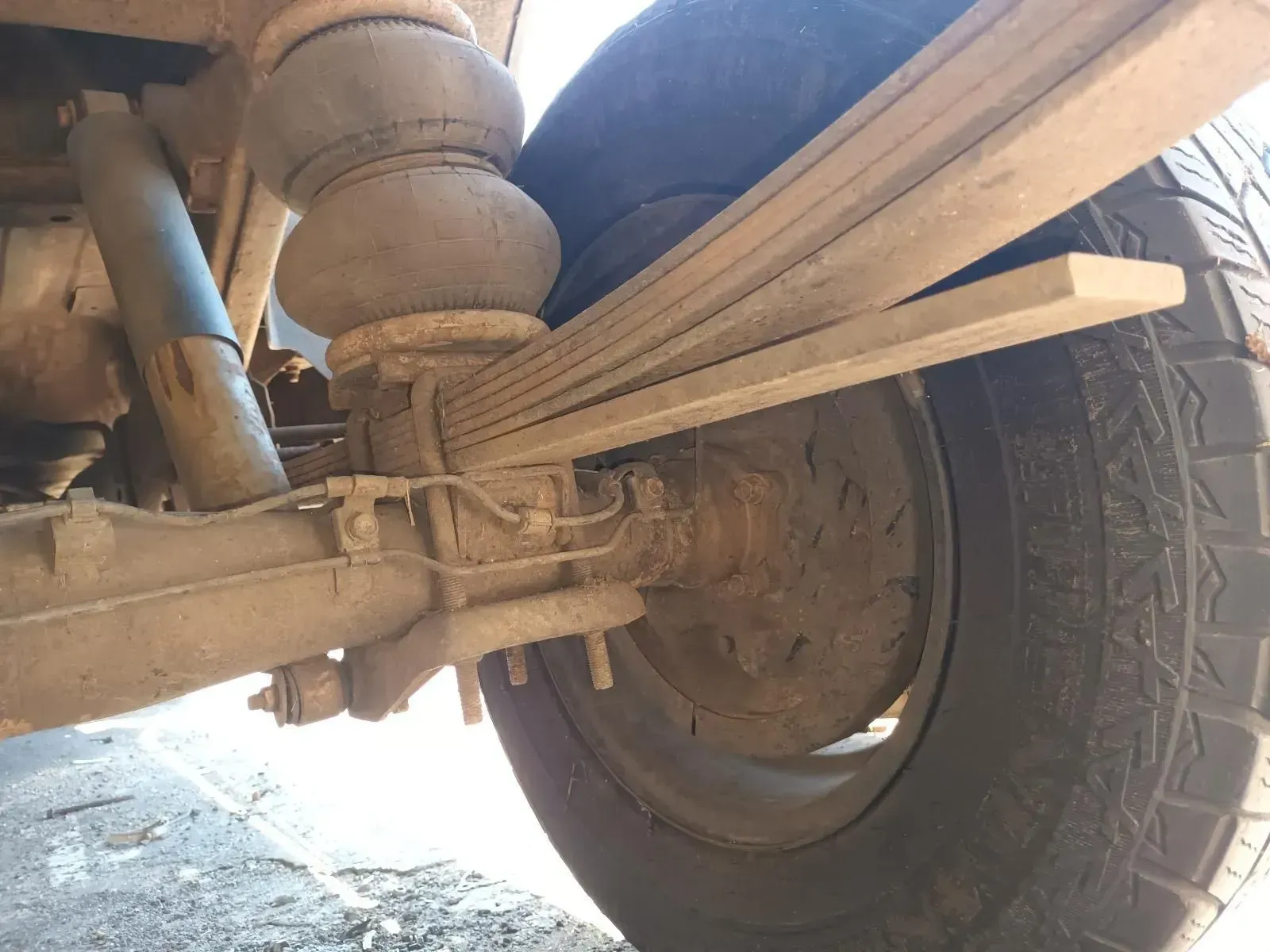 Close-up of a Truck's Rear Suspension, Showing a Leaf Spring — South West 4WD Wreckers In Brisbane, QLD