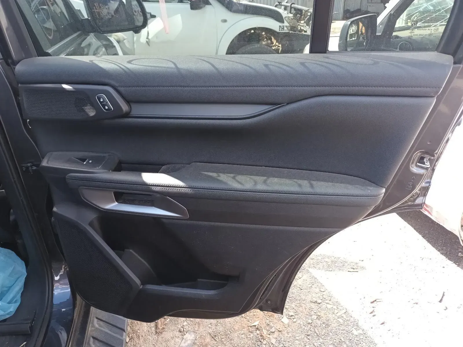 Black Car Door Panel With Armrest and Window Controls — South West 4WD Wreckers In Brisbane, QLD