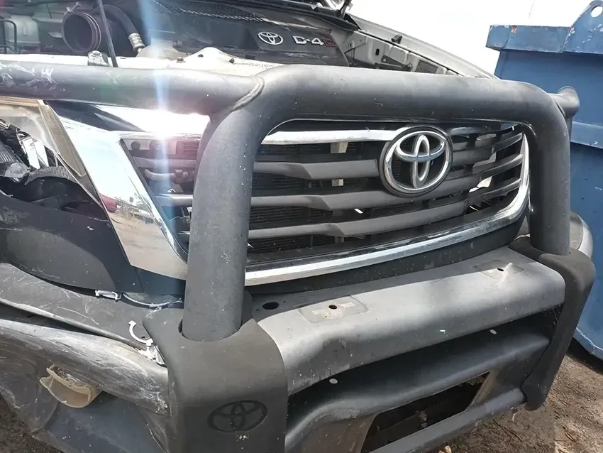 A Toyota Truck with the Hood Up is Parked in the Dirt — South West 4WD Wreckers In Brisbane, QLD