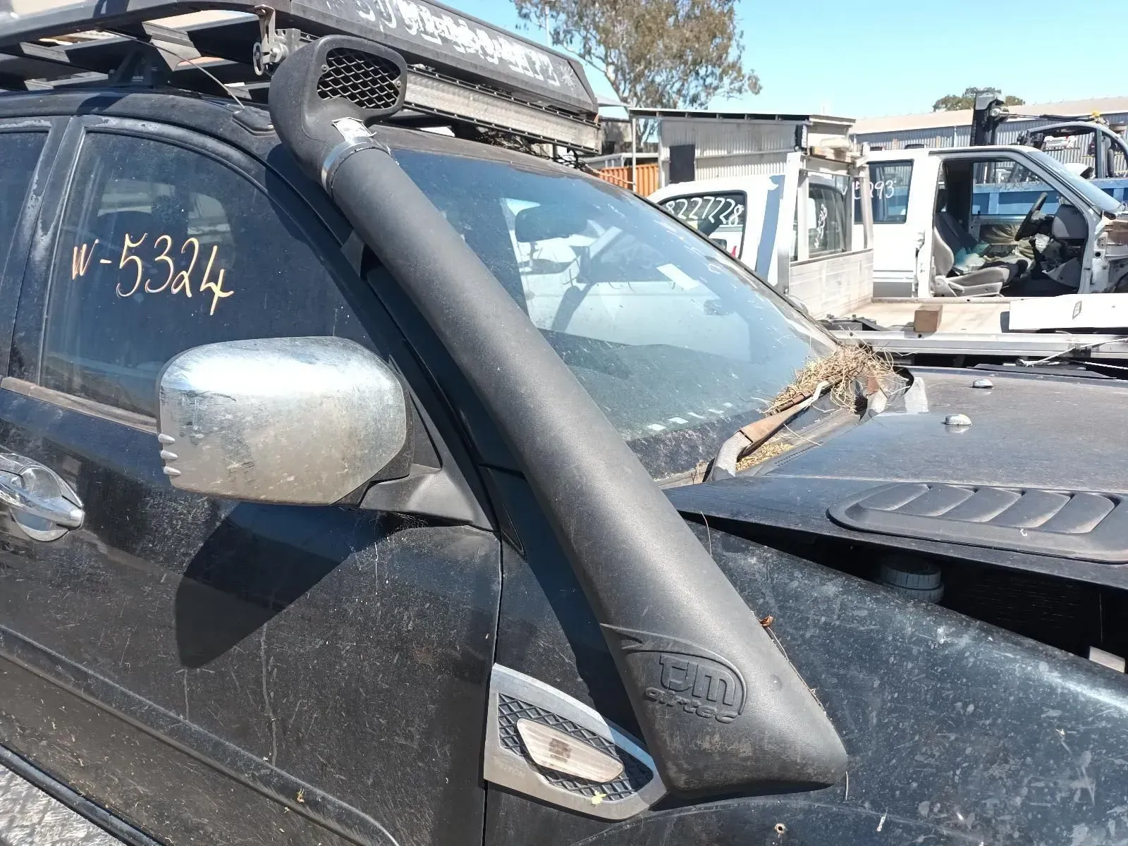 Black Suv With a Snorkel Attached to the Side, Parked Outside — South West 4WD Wreckers In Brisbane, QLD