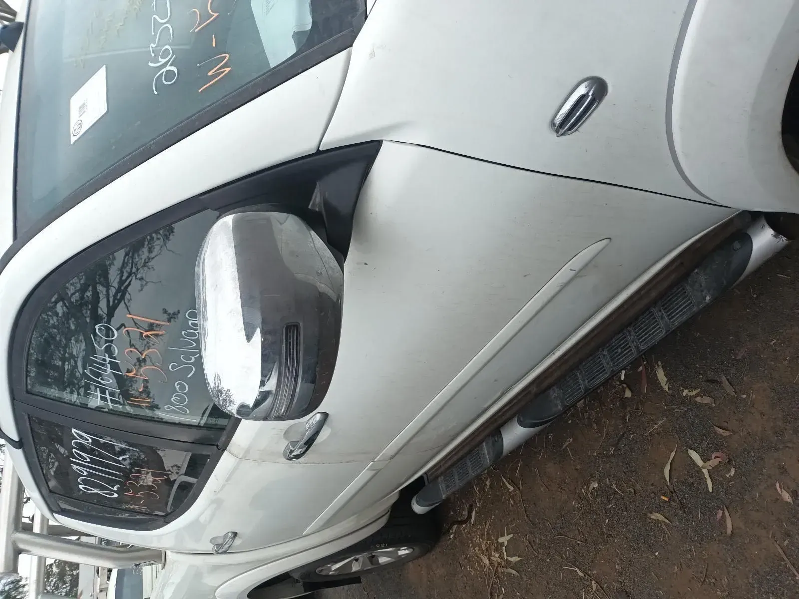 White Suv, Chrome Mirror, Parked on a Brown Surface — South West 4WD Wreckers In Brisbane, QLD