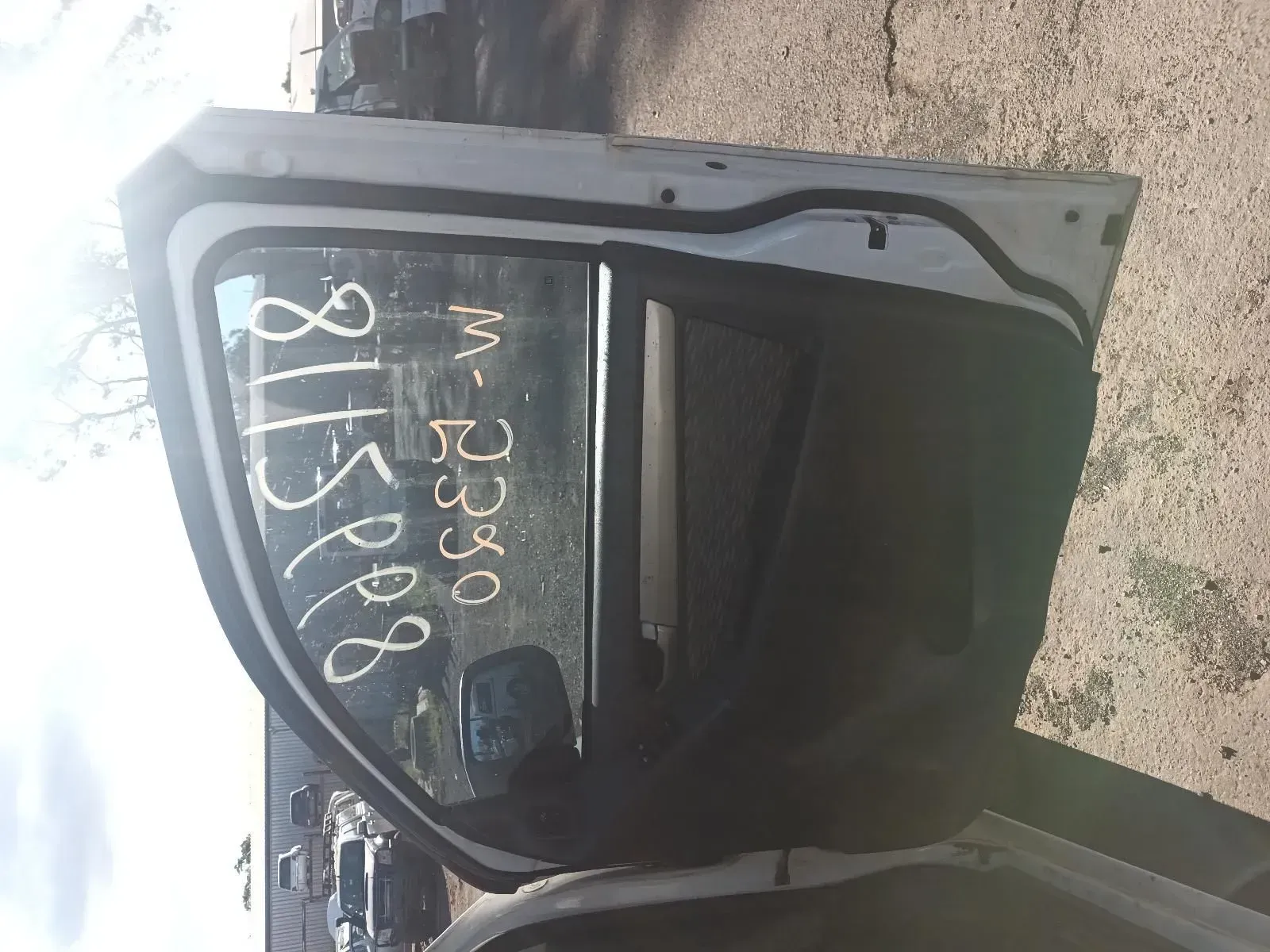 White Car Door With a Window and Markings, Outdoors — South West 4WD Wreckers In Brisbane, QLD