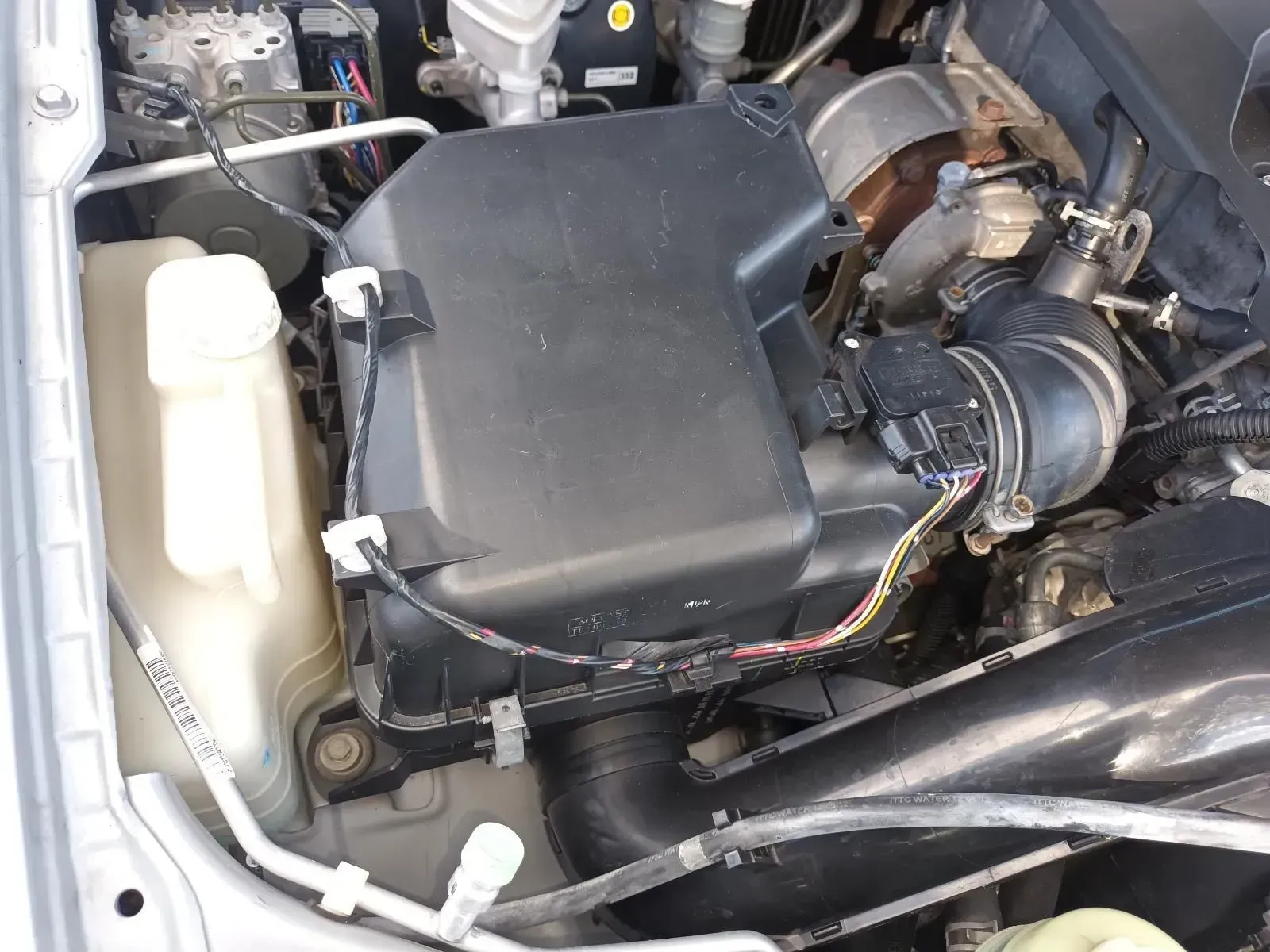 Engine Bay With Black Air Filter Housing, Coolant Reservoir — South West 4WD Wreckers In Brisbane, QLD