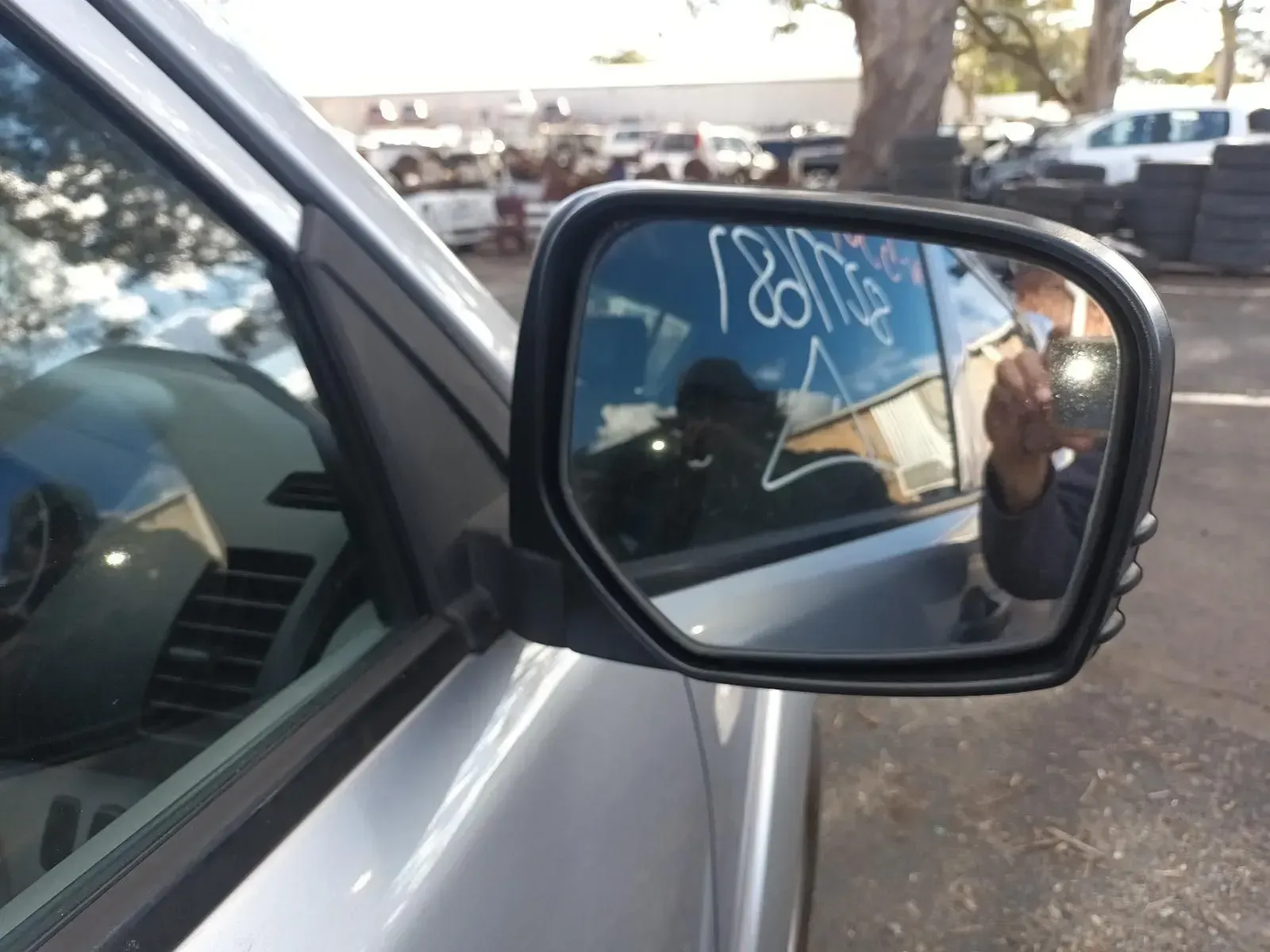 Car's Side Mirror Reflecting a Person Taking a Photo — South West 4WD Wreckers In Brisbane, QLD