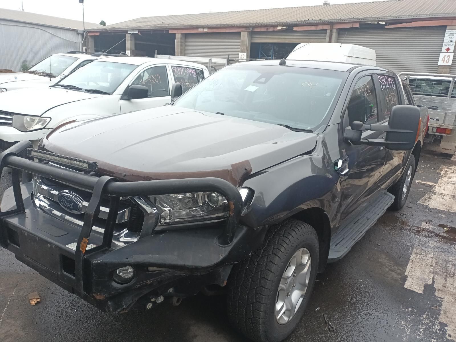A Black Pickup Truck is Parked in a Parking Lot — South West 4WD Wreckers in Harristown, QLD