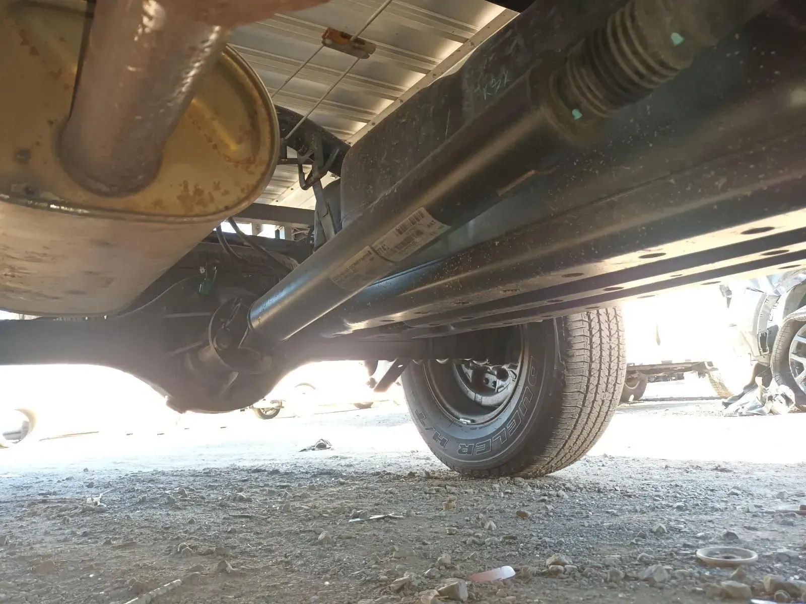 Undercarriage of a Vehicle, Showing the Exhaust, Axle, and Tyre — South West 4WD Wreckers In Brisbane, QLD