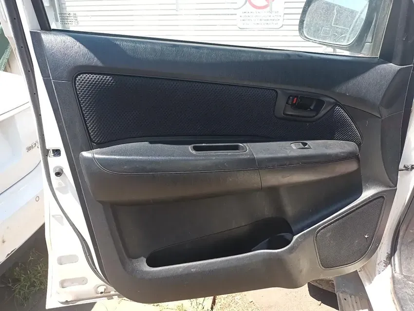 A White Car With the Door Open and a Black Door Panel — South West 4WD Wreckers In Brisbane, QLD