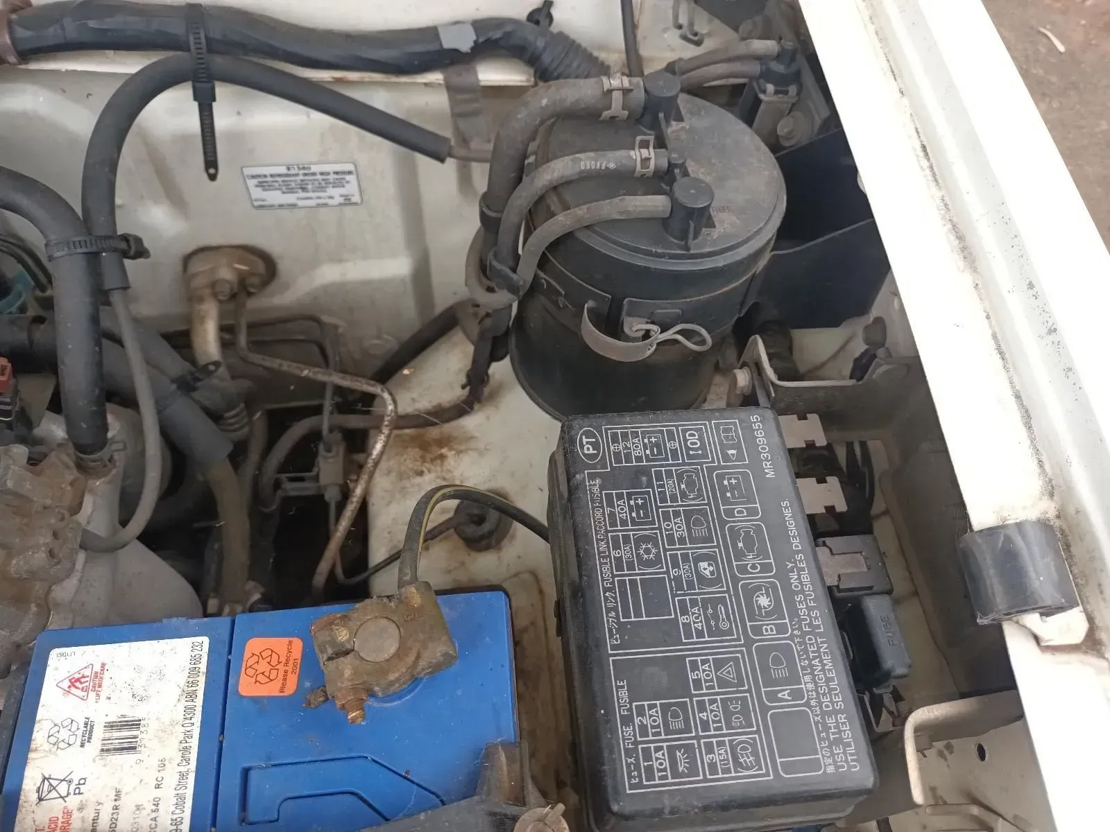 Engine Bay With Battery, Fuse Box, and Various Components — South West 4WD Wreckers In Brisbane, QLD
