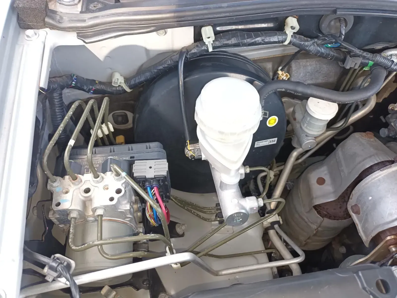 Car Engine Bay With Brake Booster, Master Cylinder, and Abs Components — South West 4WD Wreckers In Brisbane, QLD