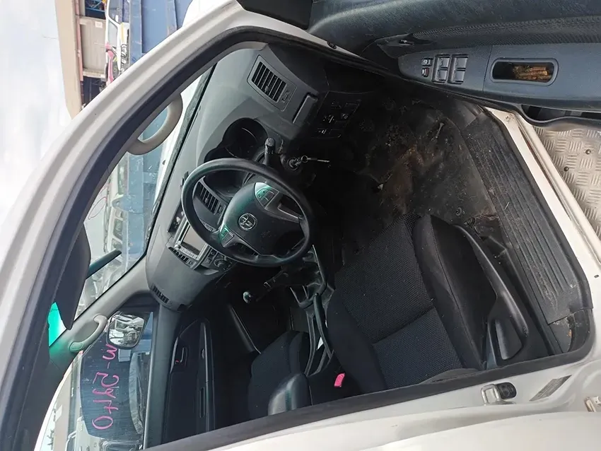 The Inside of a White Car with the Door Open and the Steering Wheel Visible — South West 4WD Wreckers In Brisbane, QLD