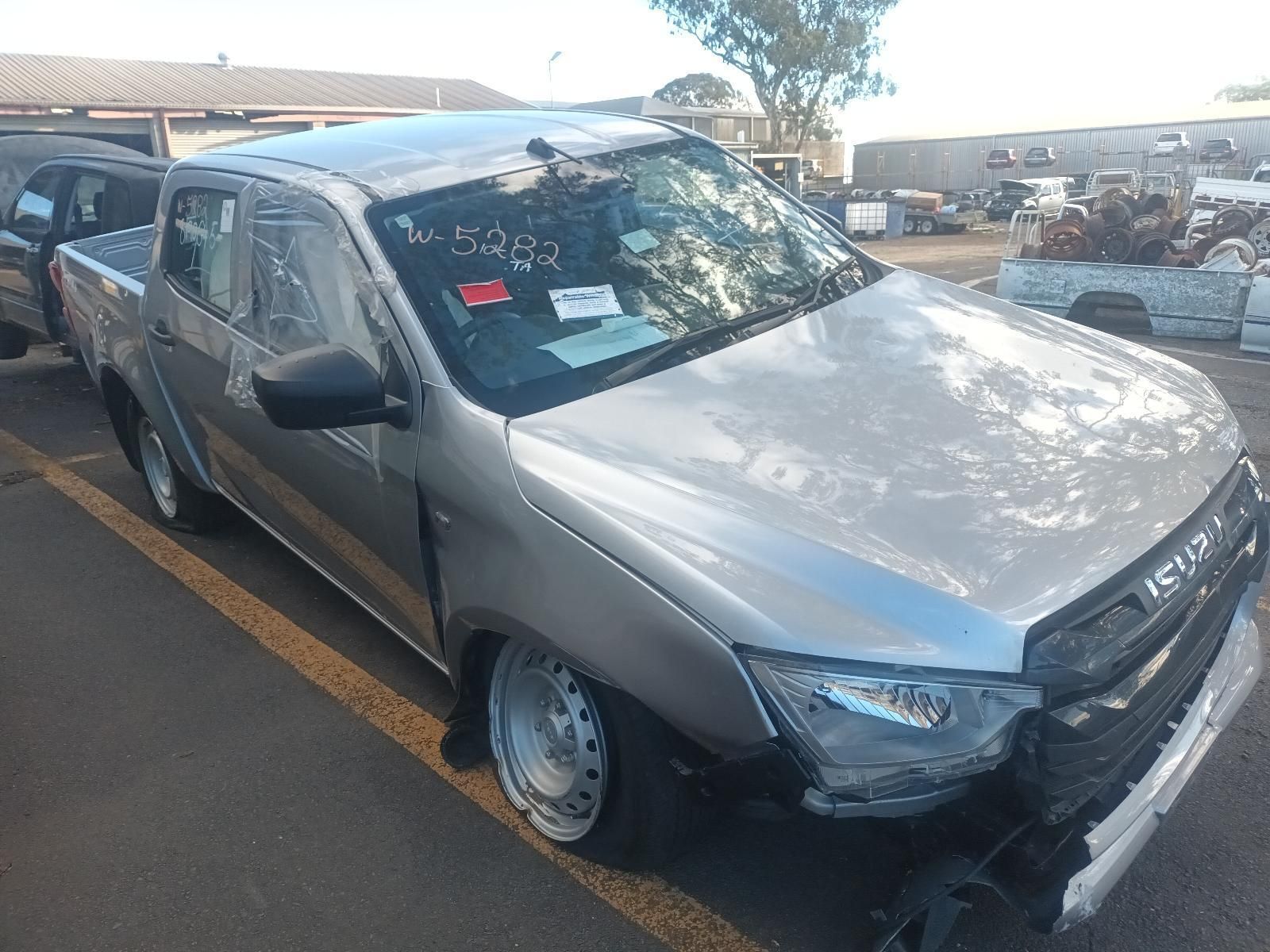 A Silver Pickup Truck is Parked in a Parking Lot — South West 4WD Wreckers in Harristown, QLD 
