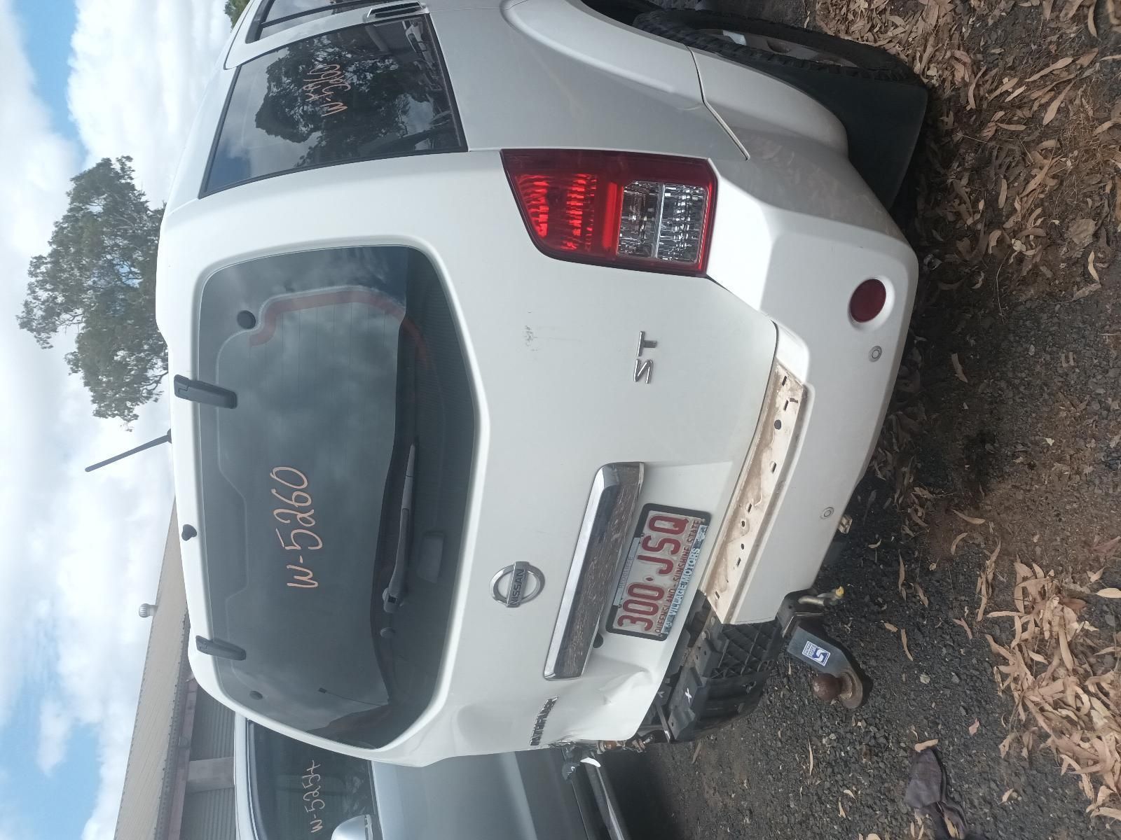 A White Nissan is Sitting on the Ground — South West 4WD Wreckers in Harristown, QLD